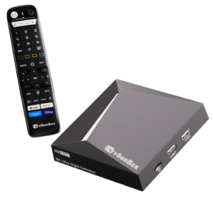 VSeeBox V6 Pro media player and Bluetooth remote, showing the two side USB ports and TF card slot